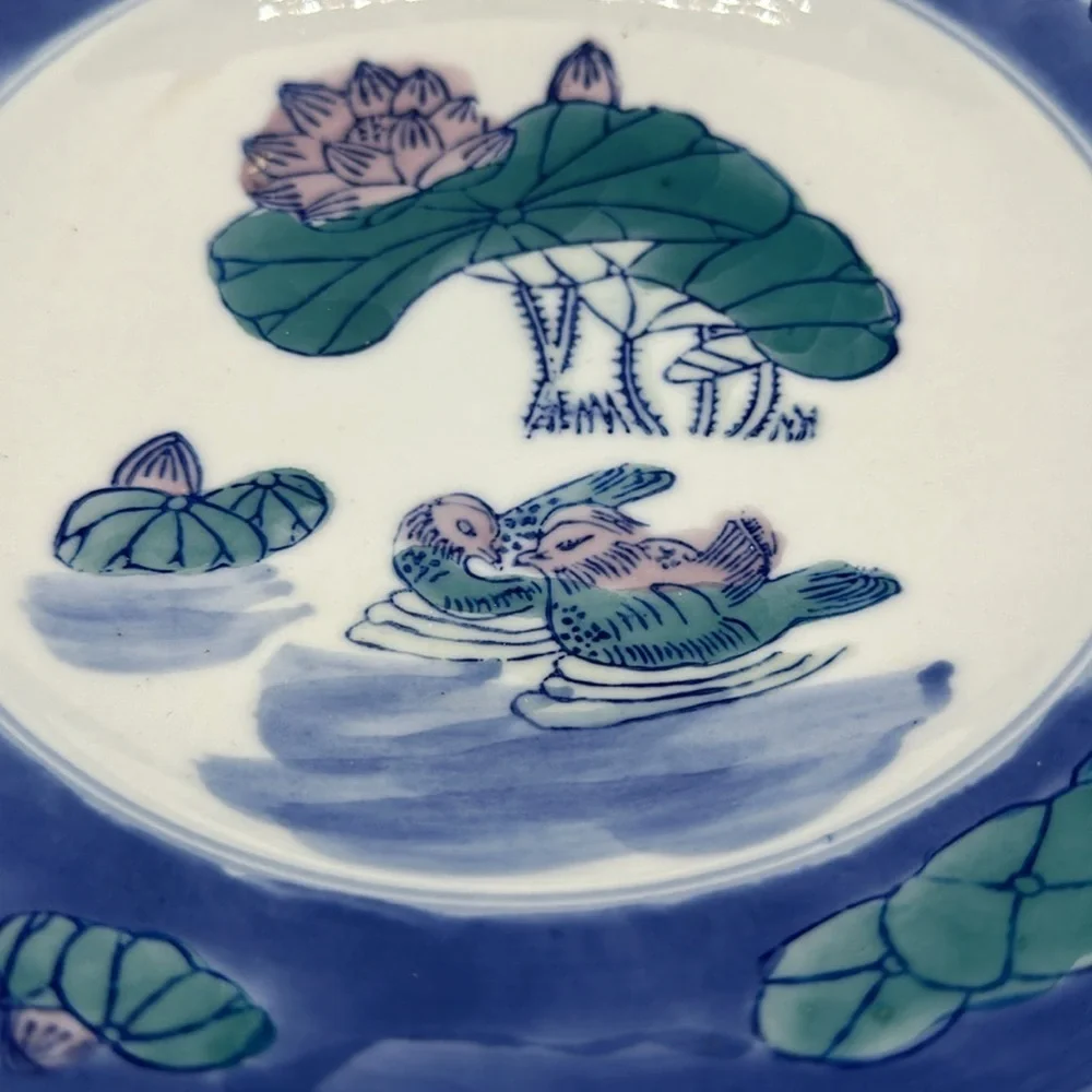 Chinese blue, white, and teal serving bowl with birds and lily pads